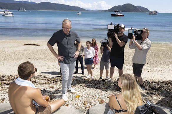 Opposition Leader Anthony Albanese meets with people on the beach during a visit to Fitzroy Island, Queenland.