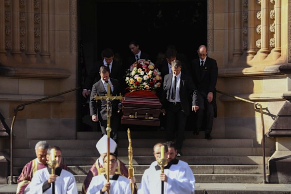 The coffin is carried out after the service.