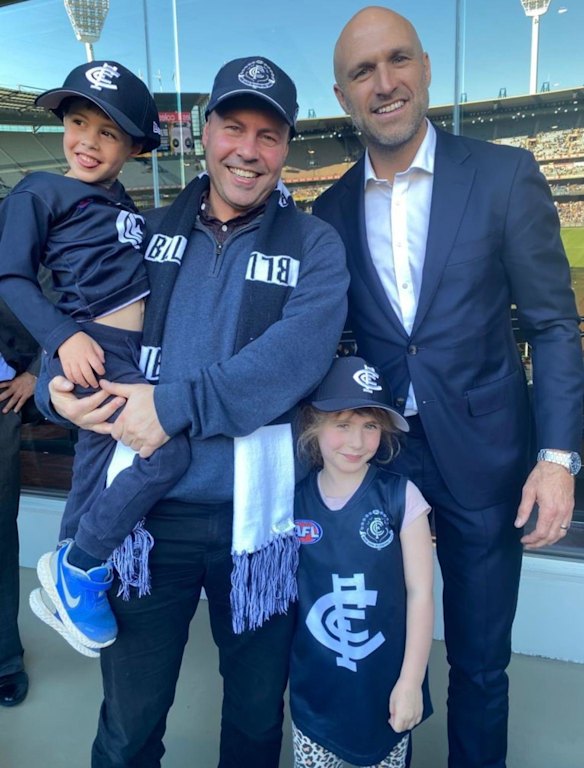 Former federal treasurer and Carlton No.1 ticket holder Josh Frydenberg with son Blake, daughter Gemma and former Carlton captain Chris Judd.