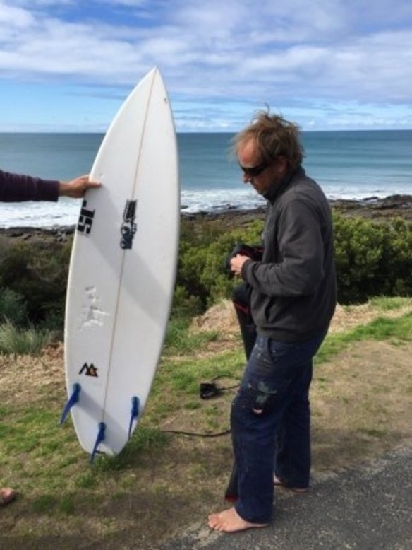 Marcel Brundler used his surfboard to fend off the shark.