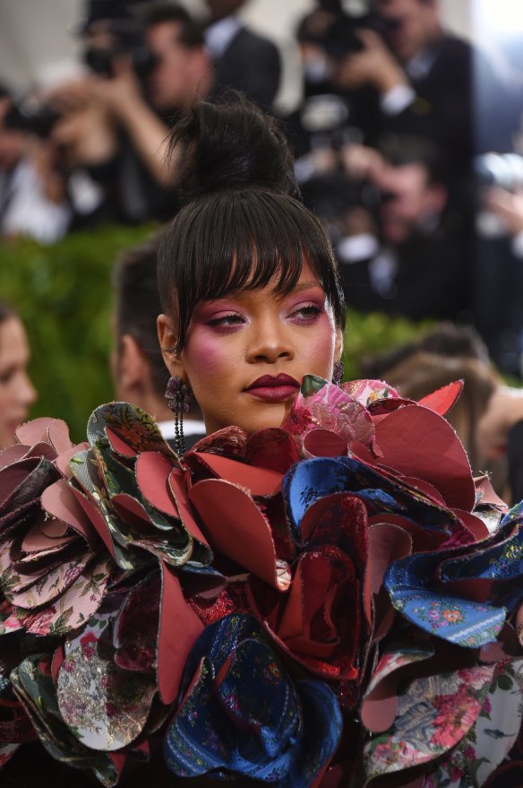 On theme and winning the internet ... Rihanna attends the Met Gala in Comme Des Garcons.