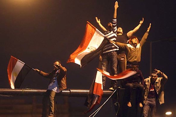 Egyptians celebrate at Tahrir Square after President Hosni Mubarak resigns.