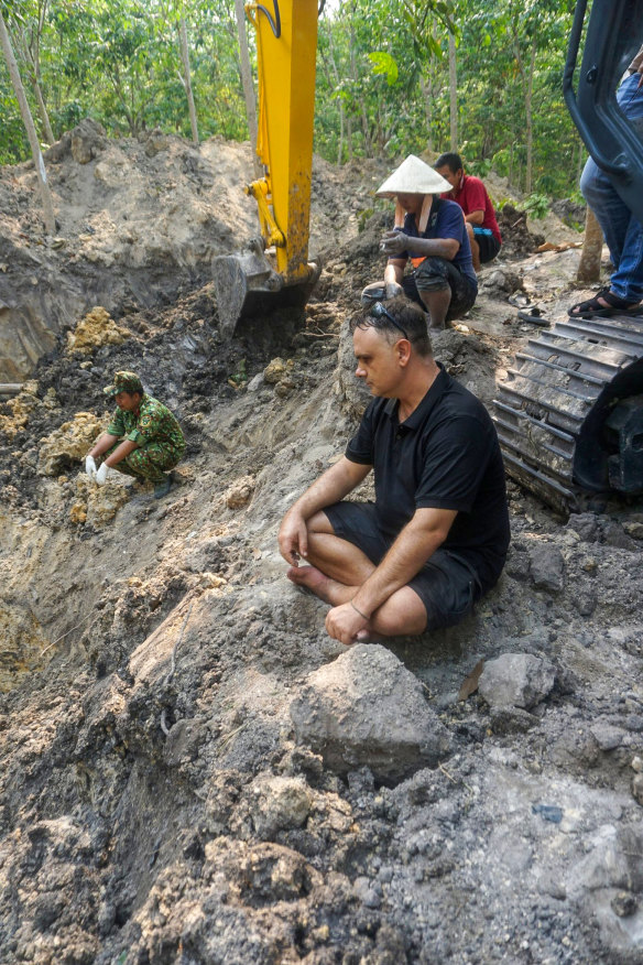 Luke Johnston at the mass grave he discovered in an old bomb crater at the site of the battle of Balmoral. 