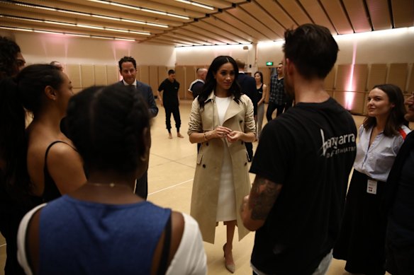 The Duke and Duchess of Sussex Harry and Meghan, and Bangarra's chair Michael McDaniel watch a rehearsal of Spirit 2018 at the Opera House in Sydney.