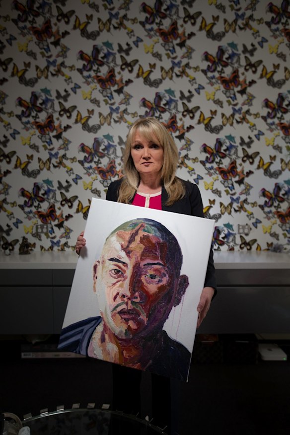 Melbourne pastor Christie Buckingham with a painting of Andrew Chan by fellow Bali nine member on death row Myuran Sukumaran. 