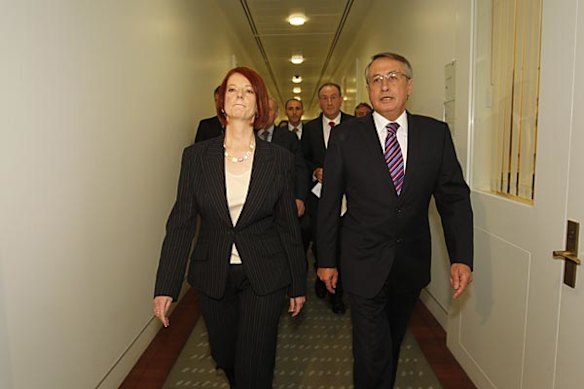 Prime Minister Julia Gillard emerges from the leadership ballot with Wayne Swan after defeating Kevin Rudd.