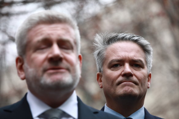Mathias Cormann, standing behind Mitch Fifield after announcing his resignation, was an instrumental player in Malcolm Turnbull's demise. 