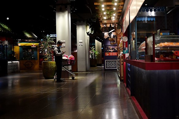 A lone shopper is seen at the foodcourt at Westfield Chatswood on Sunday.