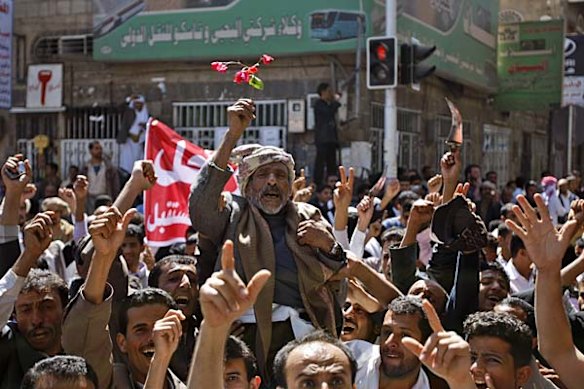 Yemeni anti-government demonstrators chant slogans during a demonstration in Sanaa, Yemen.