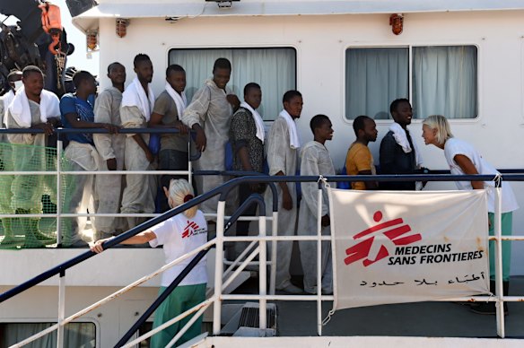 Mary Jo Frawley (right) with Medecins Sans Frontieres says goodbye as the 415 people rescued off the Libyan coast by the Migrant Offshore Aid Station (MOAS) supported by Medecins Sans Frontieres (MSF) on the MY Phoenix disembark in Taranto, Italy.