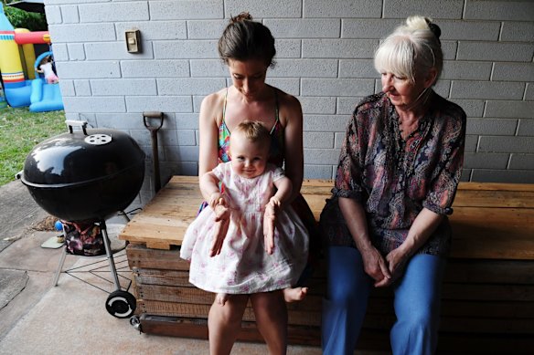 Bethan McElwee and her mother Chris Bethan, during the first birthday party for their daughter Aviana at their Darwin home.