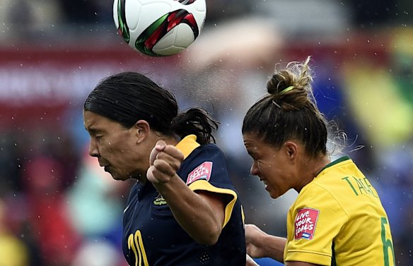 Brazil's defender Tamires and Australia's Samantha Kerr vie for the ball.