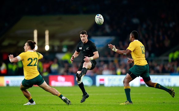 Man of the match: Dan Carter kicks over the Australia defensive line.