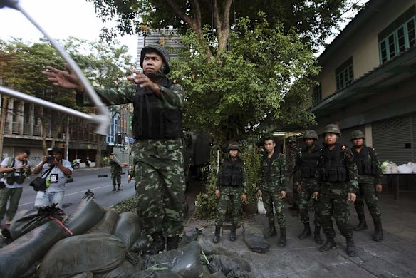 Soldiers unload equipment as they take their positions after the coup.