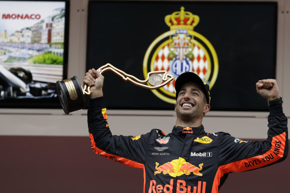 Daniel Ricciardo celebrates on the podium. 