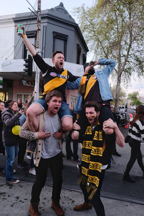 Richmond supporters celebrating their teams win over Adelaide during the AFL Grand Finals in Swan st Richmond.  Photo Luis Enrique Ascui