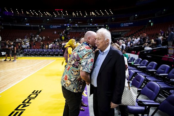 Chairman and Owner of the Sydney Kings Basketball Team Paul Smith hugs Owner of Hungry Jacks Jack Cowin after a Sydney Kings v Melbourne United NBL game at Qudos Bank Arena in Sydney.