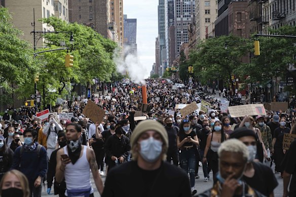 Protesters march through midtown as part of a demonstration Tuesday in New York.