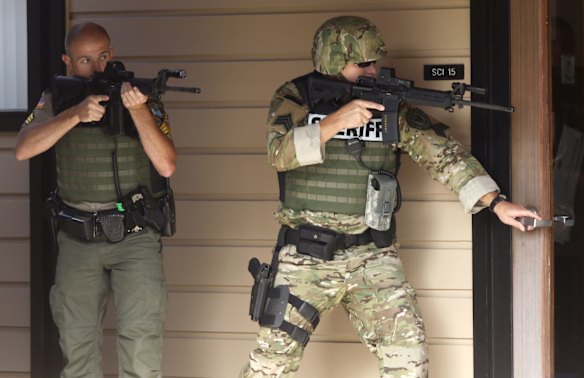 Police at Umpqua Community College in Roseburg, Oregon, after a gunman killed 10 people.