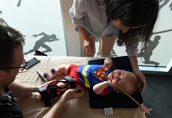 Bethan McElwee with her daughter Aviana during physiotherapy session.