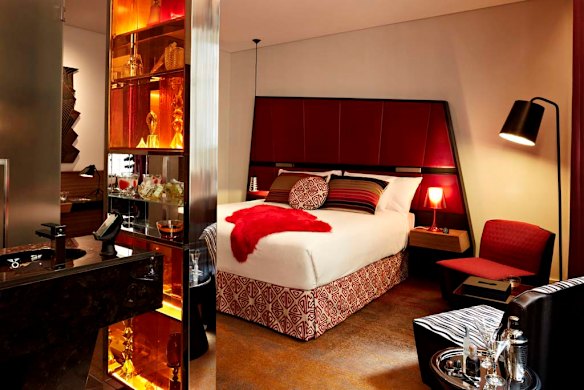 A giant asymmetrical red bedhead dominated Angie Kelly's room at QT Sydney.
