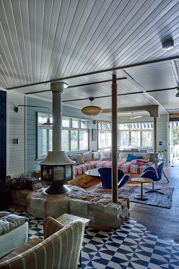 The stone hearth was created from
salvaged sandstone fashioned by Court’s stonemason to create a divide between the library and lounge.