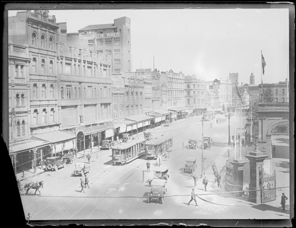 Trams, cars and people on George Street from the corner of Druitt Street, Sydney, ca. 1925.