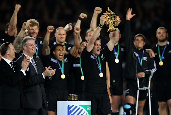 Richie McCaw of the All Blacks lifts the Webb Ellis Cup.