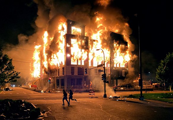 A six-storey building under construction across from Minnehaha Centre burns out of control on May 28, 2020, in Minneapolis, Minnesota. Violent protests after the death of George Floyd, a black man who died as police arrested him, rocked a Minneapolis neighbourhood for a second straight night as angry crowds looted stores, set fires and left a path of damage that stretched for miles.