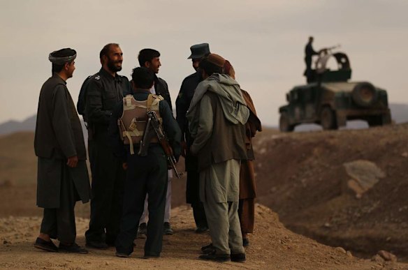 Uruzgan Police Chief, Matiullah Khan, 2nd from left, amongst his men on the Tarin Kowt to Kandahar highway, on the outskirts of Tarin Kowt town.