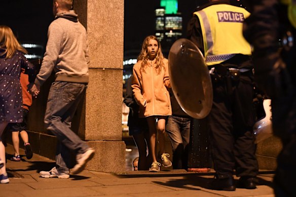 People are lead to safety on Southwark Bridge away from London Bridge after an attack.