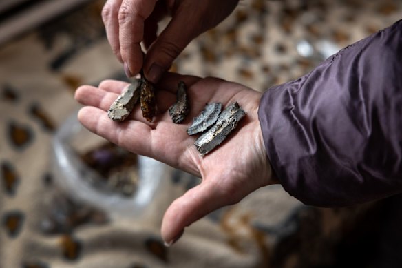 Local resident Oksana shows off shrapnel found in the remnants of her multi-generational home in Hostomel. 
