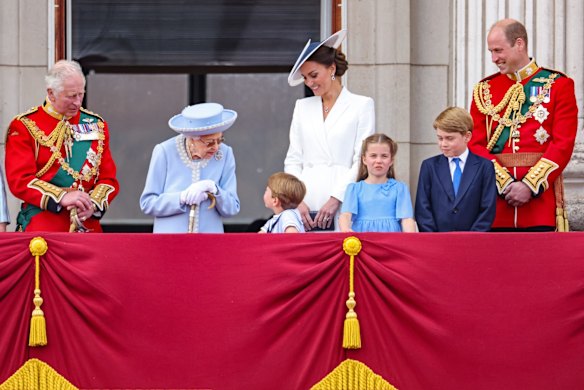 The Queen chats to Prince Louis during the royal family's balcony appearance.