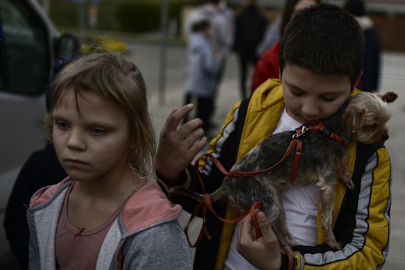 Ukrainians Oria Oscaria and her brother Ego with their pet after arriving in Cizur Menor, northern Spain after Russian's invasion of Ukraine. Oscaria's brothers and family were traveling with other Ukraine more than five thousands kilometers to arrive in Spain.