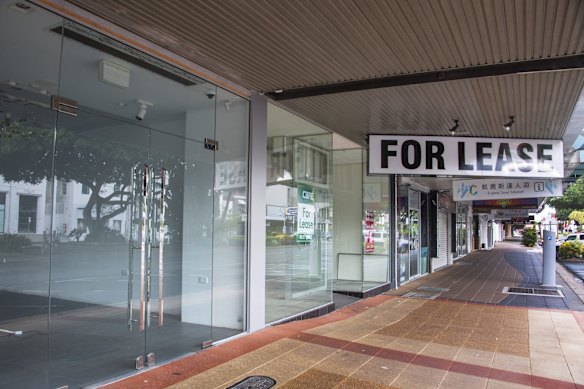 A row of shuttered and empty shops in Abbott Street in the Cairns CBD.