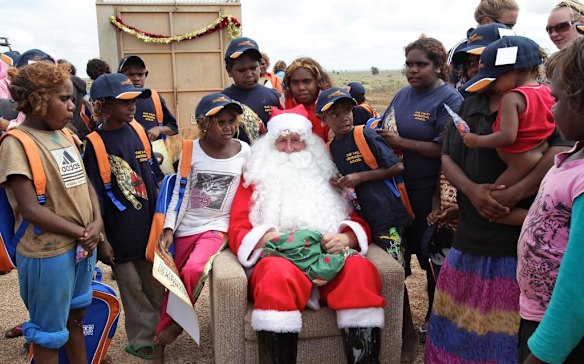 Children from Oak Valley Aboriginal School meet Santa Claus at Watson on The Nullabor Plain in South Australia as part of The Indian Pacific Outback Christmas Train where singer Jessica Mauboy performs a series of concerts during the train trip from Sydney to Perth. Watson is the highlight of the long journey across Australia on the Indian Pacific Outback Christmas Train.