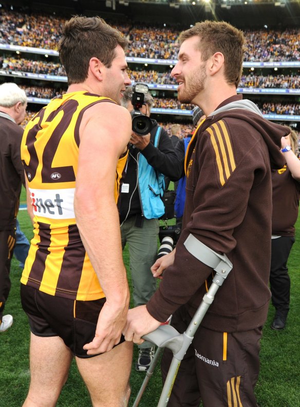 Hawthorn's Jonathan Simpkin with Brendan Whitecross after the 2013 grand final.