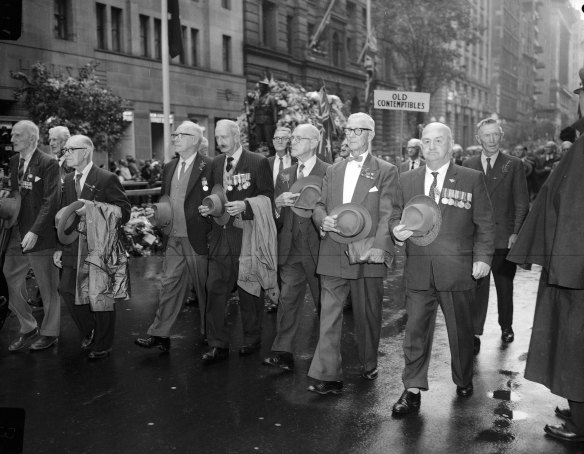 “Spectators alternately cheered and were silent as 64 bands and marching men and women from the Boer War, two world wars, Korea and Malaya went by.”