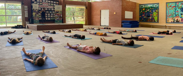 Wembley Downs Primary School students lay in savasana as part of their mindfulness practice.   