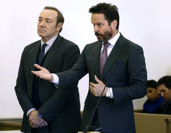 Actor Kevin Spacey stands in district court with his attorney Alan Jackson.