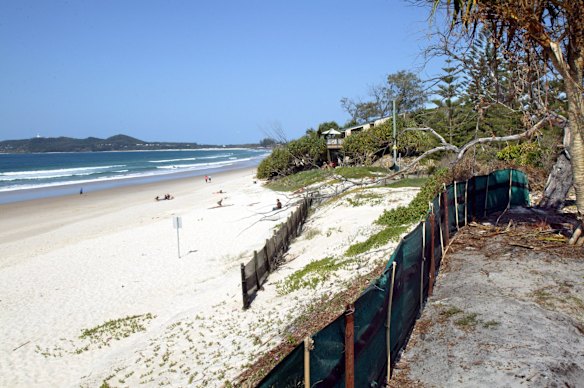 A road used to run along the front here but it has been lost to erosion and screening has been erected stop the sand blowing away at Belongil in Byron Bay. September 2003.