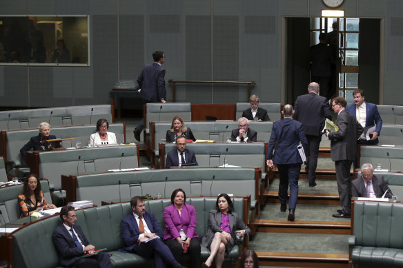 Prime Minister Scott Morrison departs the chamber as Kerryn Phelps (left) prepares to begin her maiden speech.