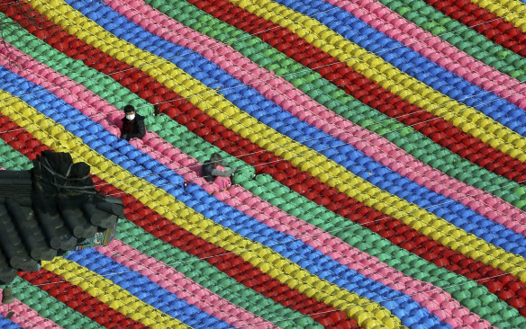Workers adjust lanterns for upcoming celebration of Buddha's birthday on May 22 at Jogye temple in Seoul, South Korea.