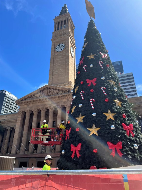 Workers put up the Christmas tree in Brisbane’s King George Square for the 2022 festive season.