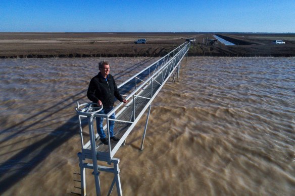 Ian Cole from Barwon-Darling at a dam for a cotton farm near Bourke that filled up after good rains last year.