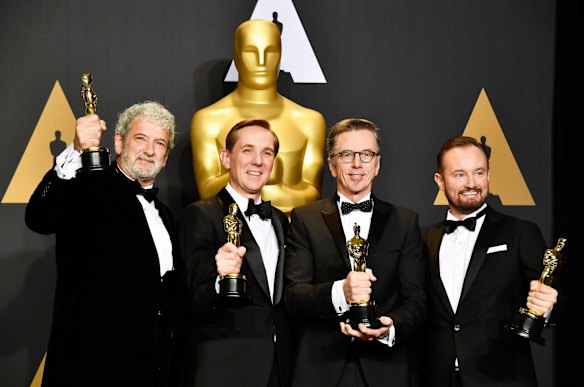 <i>Hacksaw Ridge</i> sound mixers Peter Grace, Robert Mackenzie, Kevin O'Connell and Andy Wright pose with their Oscars.