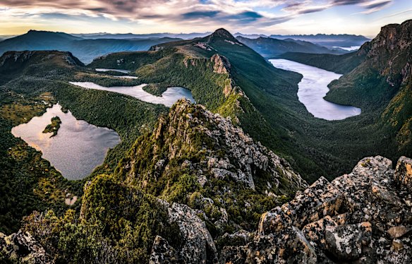 MT ELIZA: For many bushwalkers, Mt Eliza is just a through point to the domineering Mt Anne, but for day walkers the Southwest National Park peak is one of the finest outings in the state. It's a long ascent up a broad ridge from near the shores of Lake Pedder to High Camp Hut, where solid ground gives way to boulder fields. Through the boulders, the track rises to Mt Eliza's flat summit and a view par excellence - down onto Lake Pedder with its shores wrapping around mountains, across to the sawtooth profile of the Western Arthurs and with the nib of Mt Anne rising nearby. The plateau between Mt Eliza and Mt Anne flourishes into a colourful alpine flower display in summer.