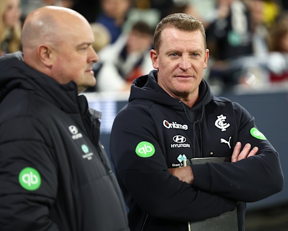 Blues coach Michael Voss, with football department chief Chris Davies, watched their team concede another hefty lead after half-time against Melbourne on Sunday.