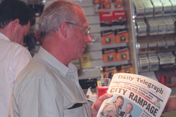Roger Rogerson buys a newspaper after appearing at Smith's murder trial.