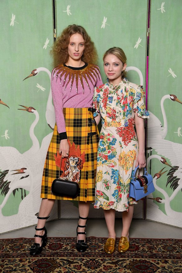 Petra Collins and Tavi Gevinson attend the Gucci Eyewear cocktail party in perfectly mismatched floral print, tartan, glitter and bold colours.